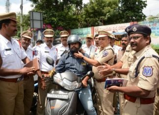 Instead of Chalans, Hyderabad Police Distributing Helmets, Insurance